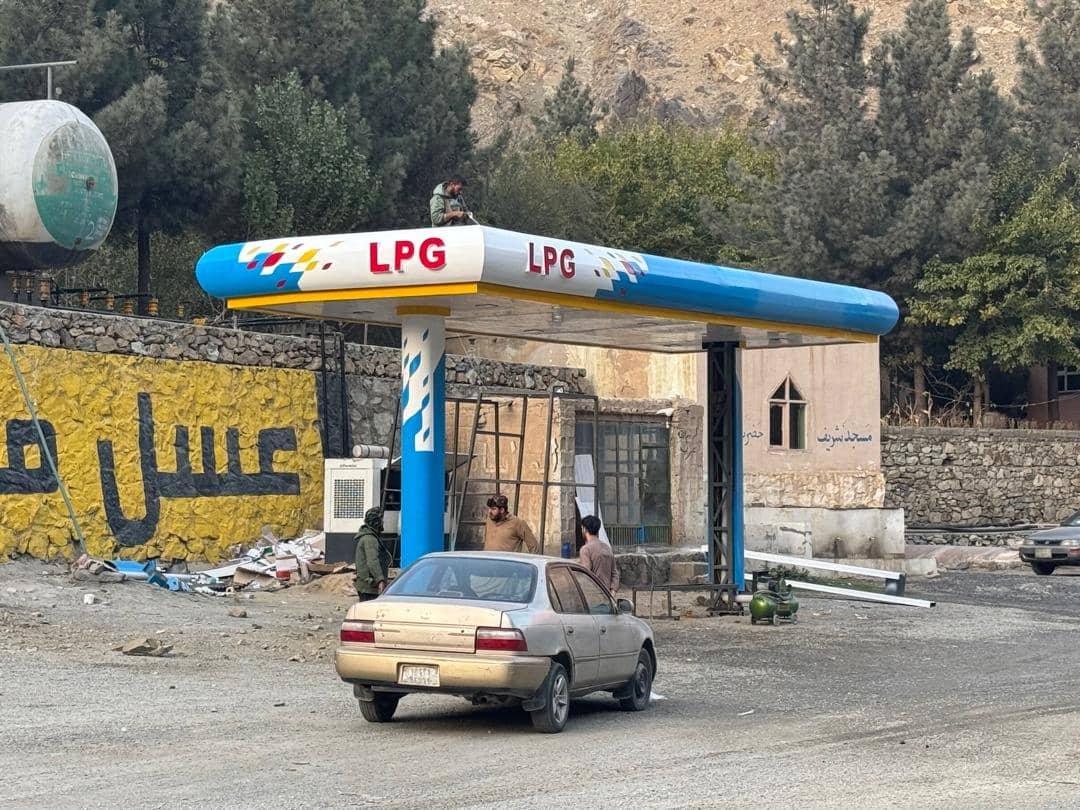 LPG station canopy with blue and white branding under installation