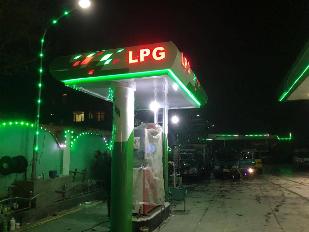 LPG fueling bay with green LED accent lighting at night