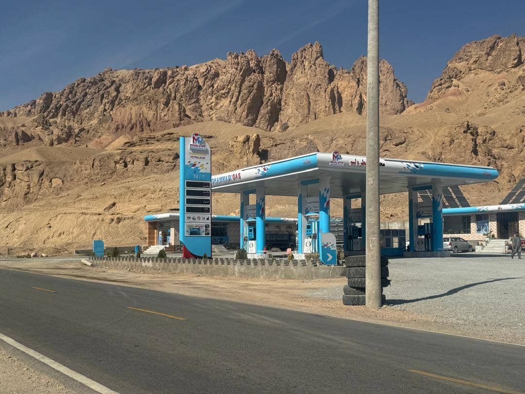 Mohammadi Gas station alongside a highway with mountain backdrop