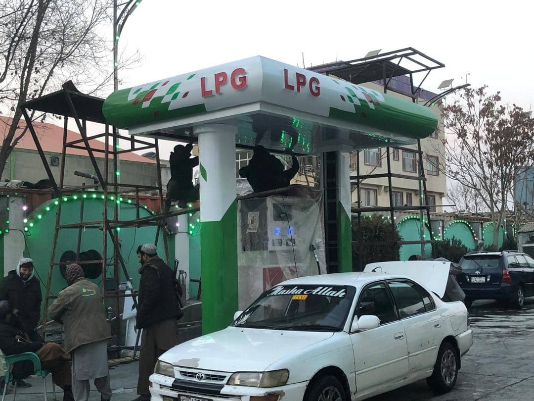 LPG station installation with workers on canopy structure